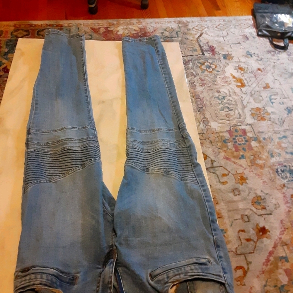 A pair of Forever 21 Moto Jeans.